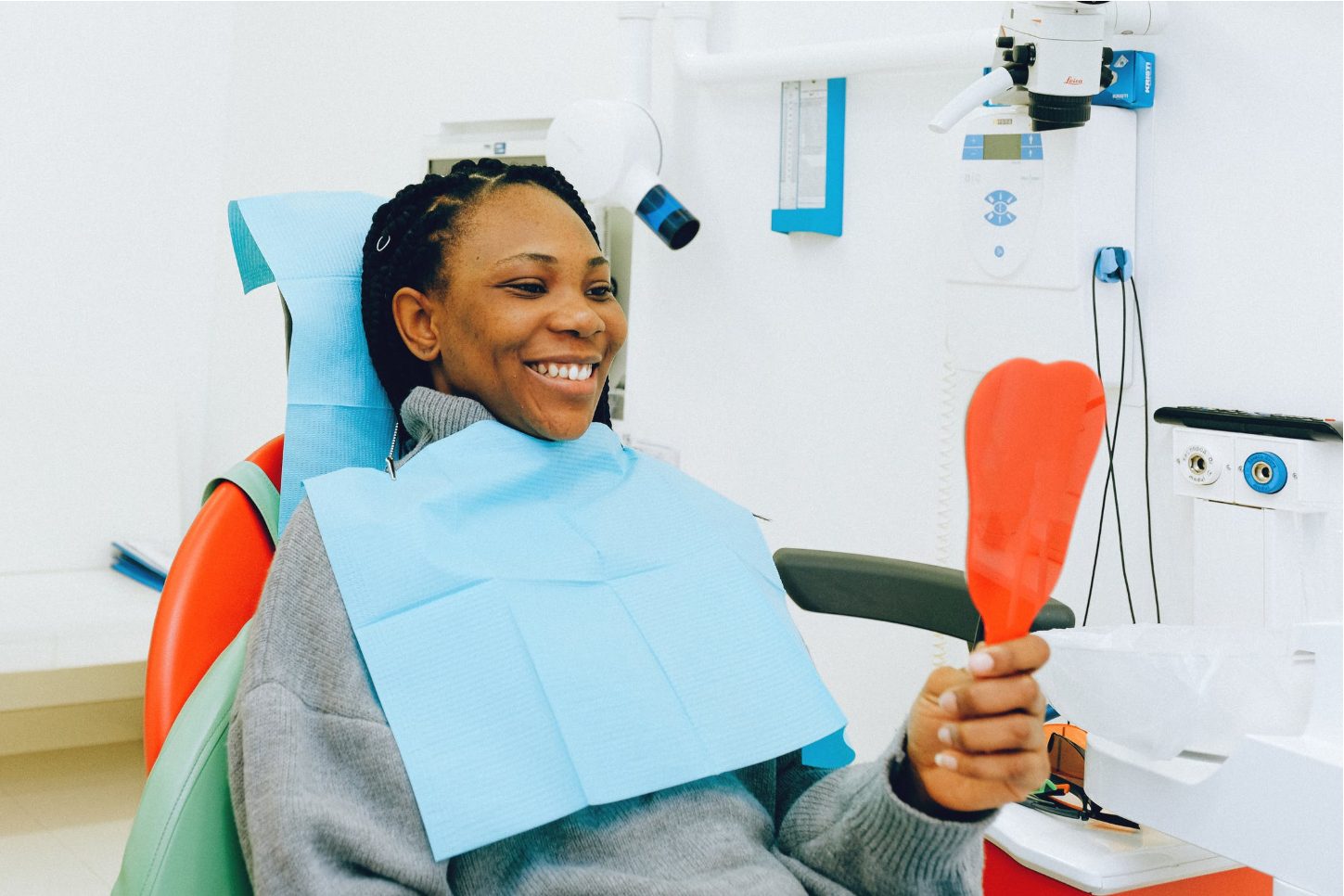 Patient checking out smile in mirror